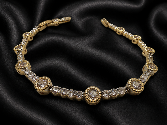 Gold bracelet with diamonds on a black satin background