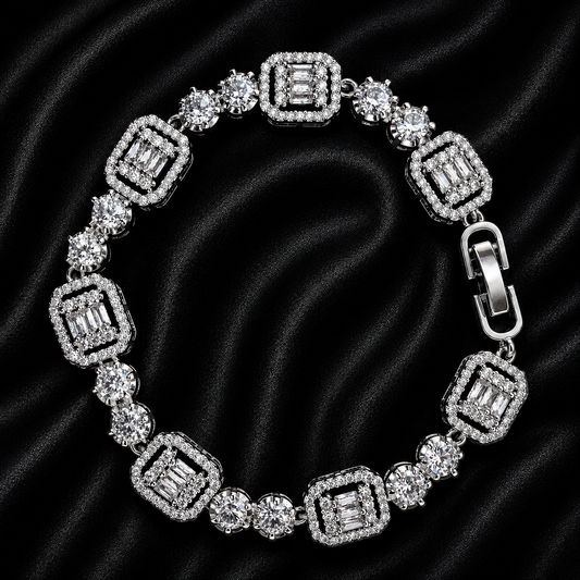 A silver-toned diamond bracelet with emerald-cut and round brilliant-cut stones, displayed on a black satin background.